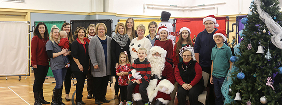 ts bank employees pose with santa at childrens square