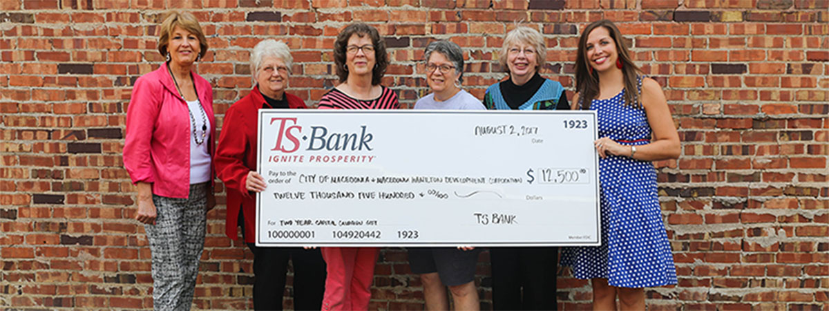 ts bank employees deliver check to city of macedonia em