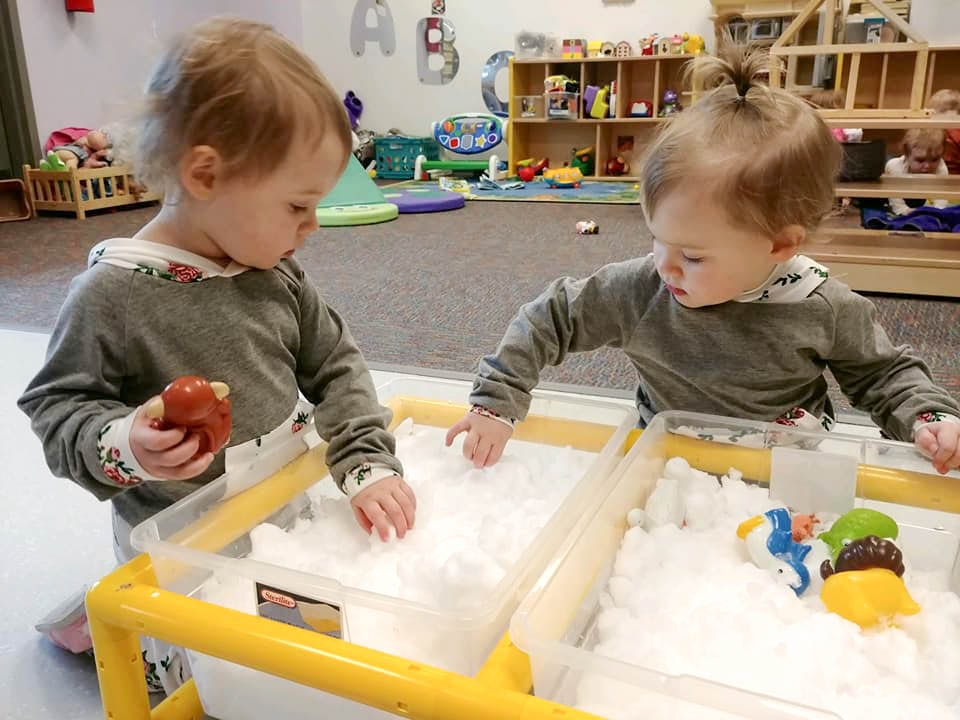 toddlers playing sensory toys at ann wickman center
