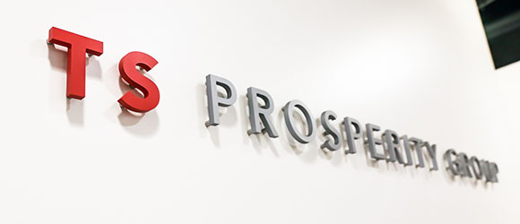 ts prosperity group logo on a wall in their office