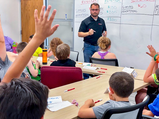 students listening to a teacher