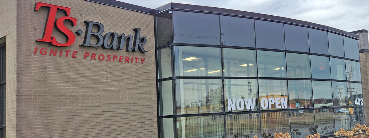 TS Bank Ames Now Open on window