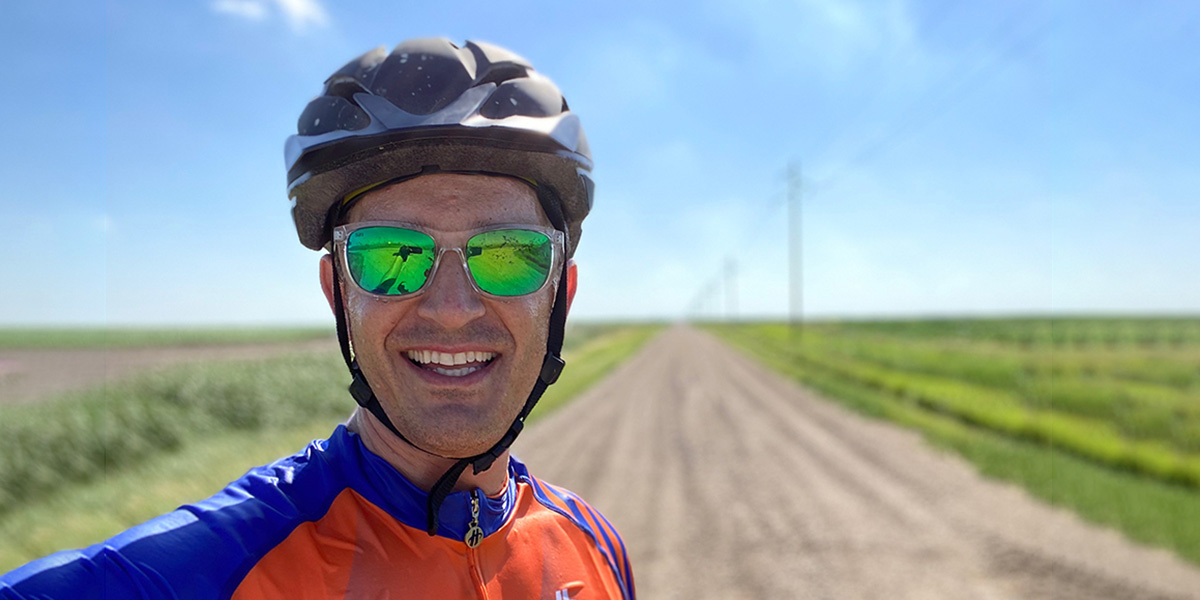 dave wise on his bike on a gravel road