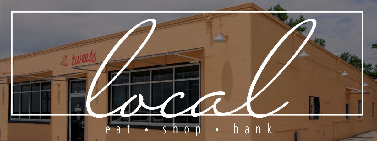 Tweets building with eat shop local wording overlay