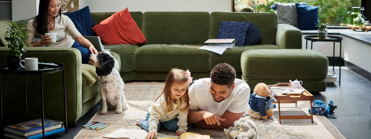 Mom watching child and husband play