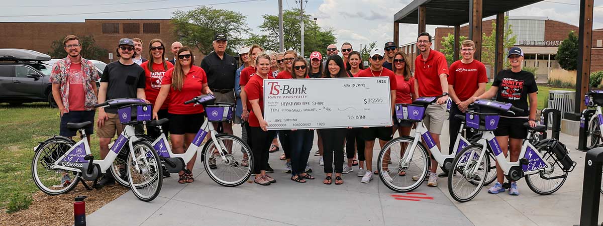TS Bank employees gift check to Heartland Bike Share