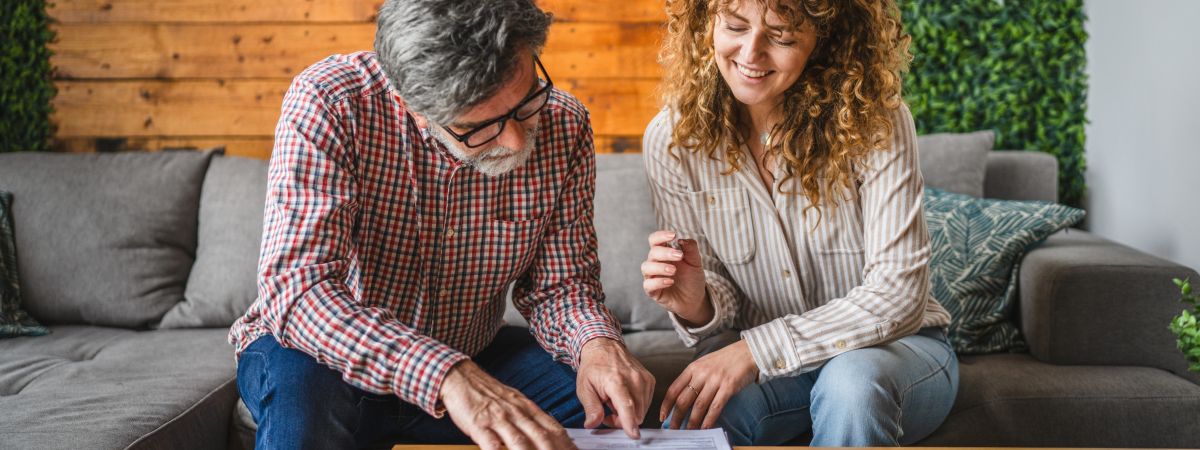 Man and woman looking over papers