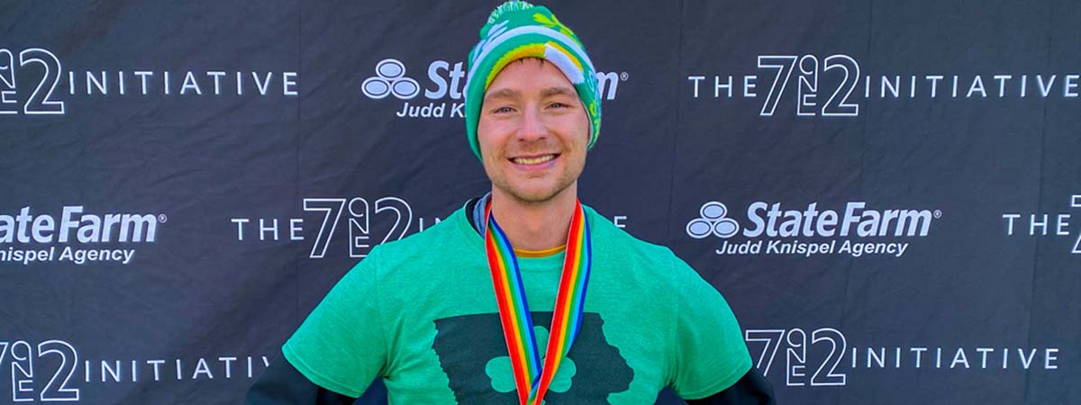 Michael Kaufmann posing with medal