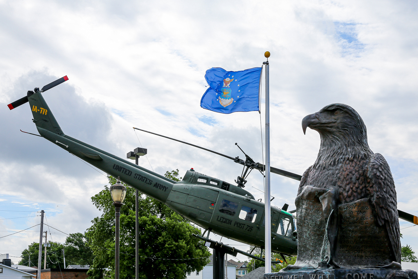 helicopter and flag and statue in treynor
