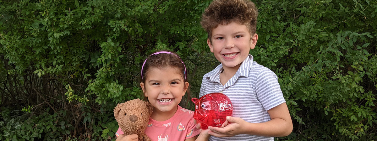 ts bank student savers pose with piggy bank