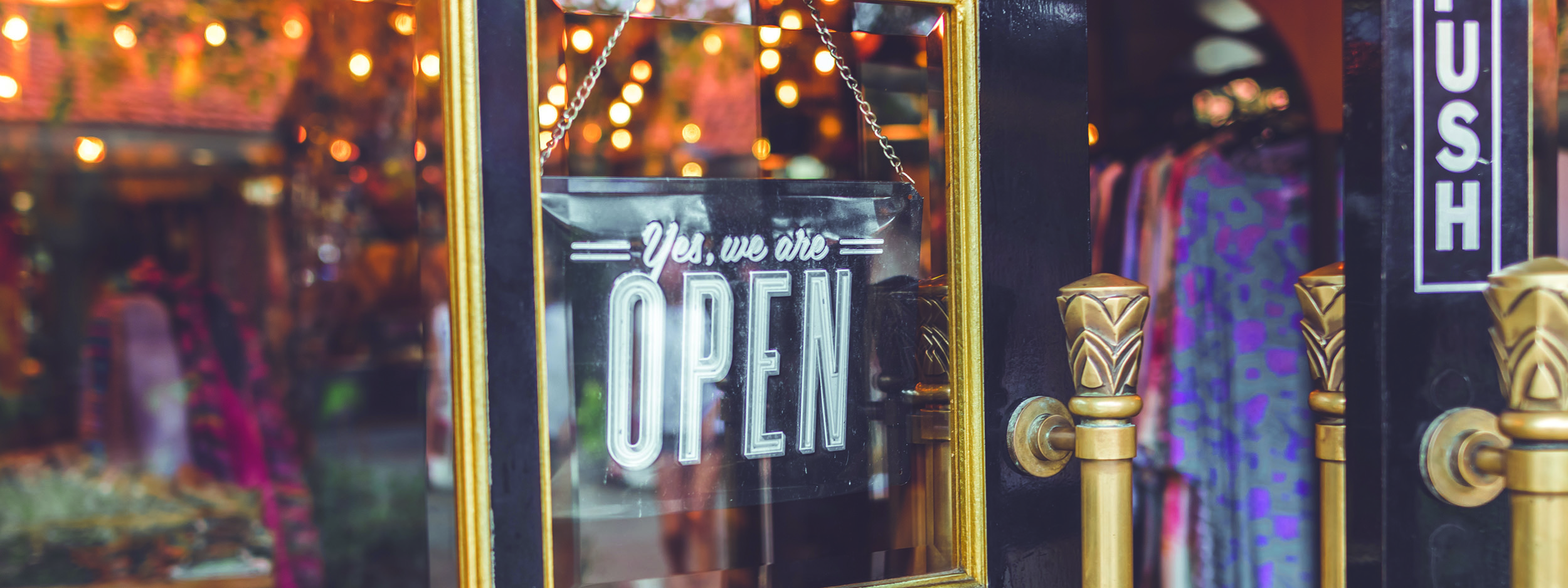 an open sign in a business window