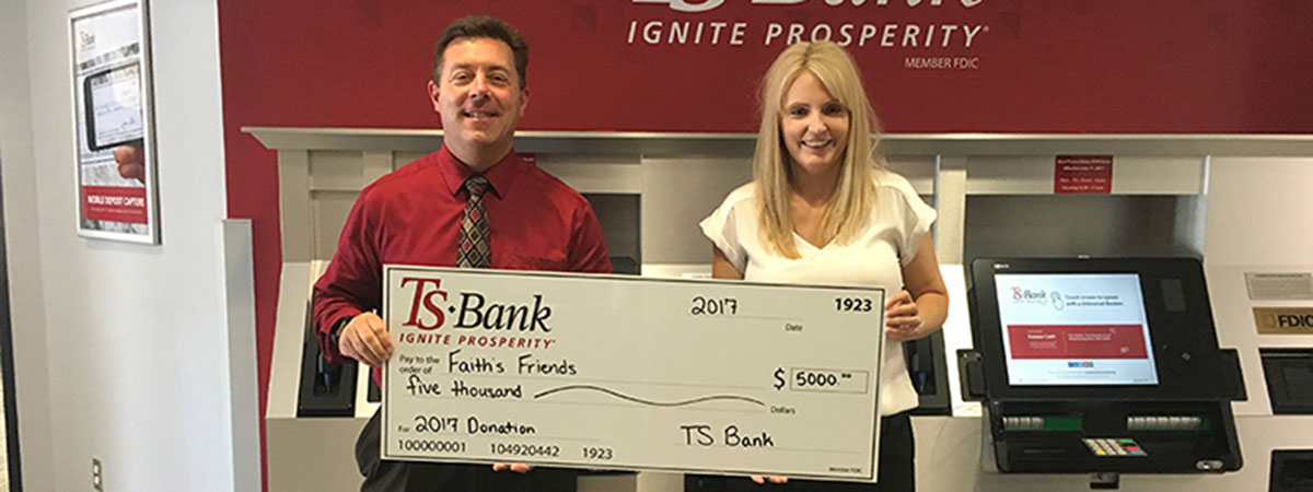 ts bank employee delivers check to faiths friends