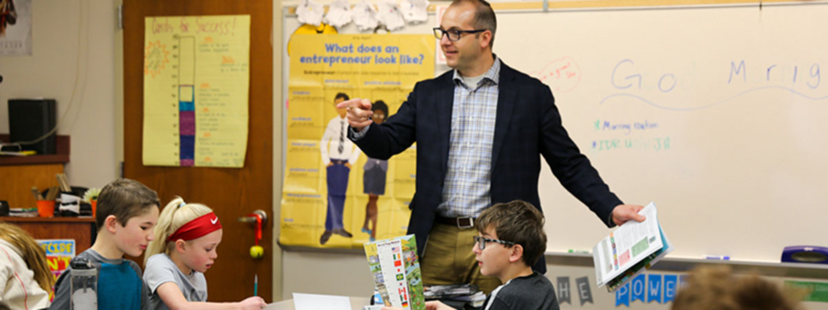 employee cody forbush teachs junior achievement in fron