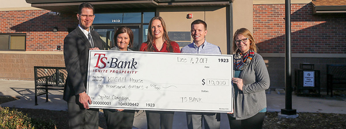 ts bank employees deliver check to micah house employee
