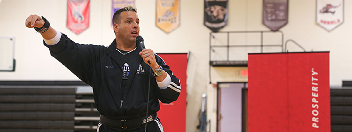 jon pritikin speaking to students at a school rally