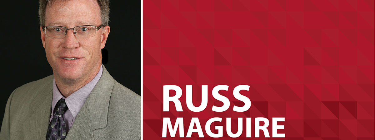 russ maguires professional headshot next to his name on