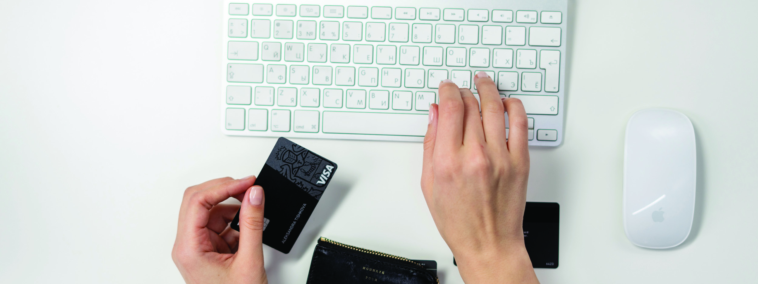 a woman typing in her credit card information