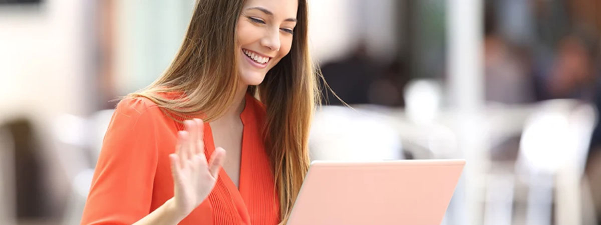 woman video chatting through her laptop