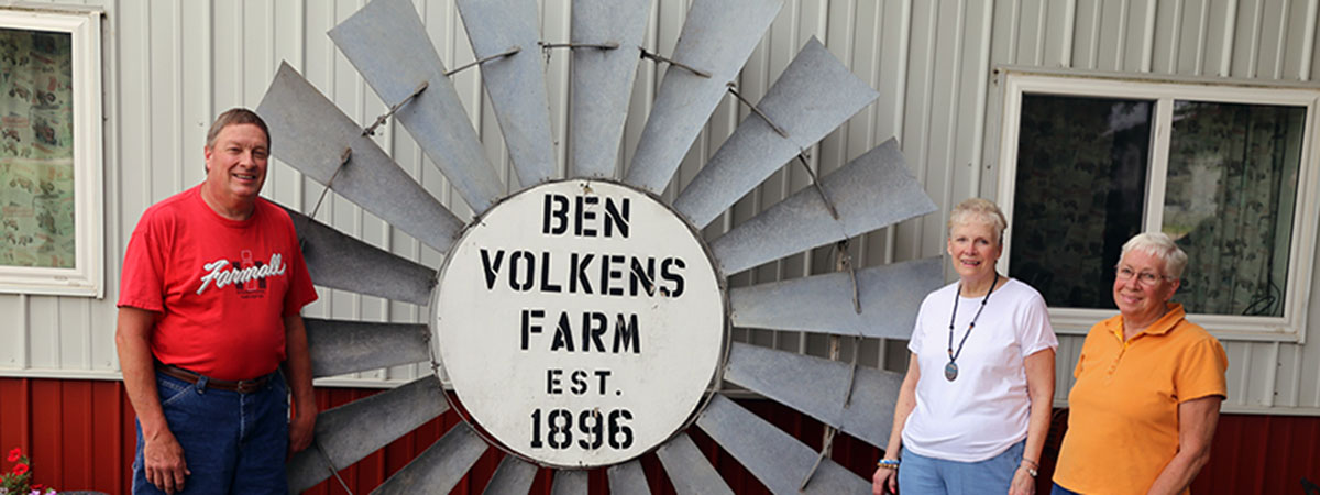 members of the volkens family stand in front of the cen