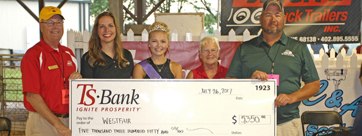 ts bank employee delivers check to westfair queen