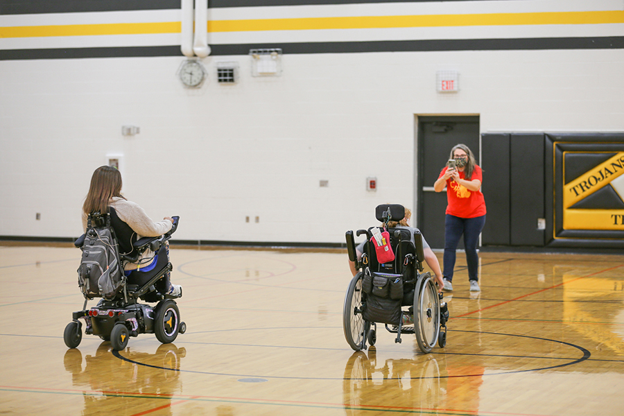 tasha schuh speaking to gym full of students