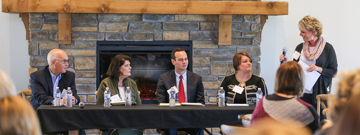 speaker at an event asking a panel a question