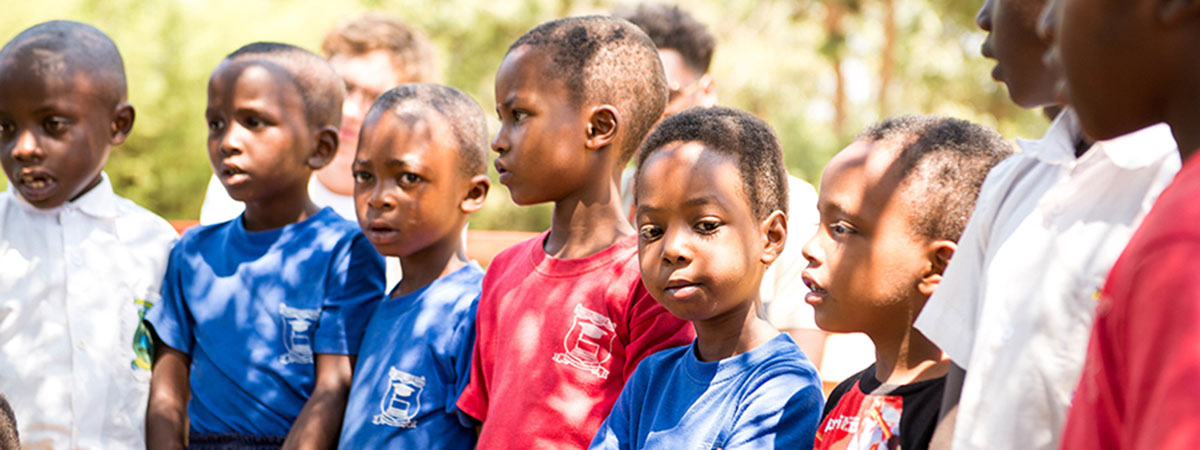 children at imana kids standing in a line