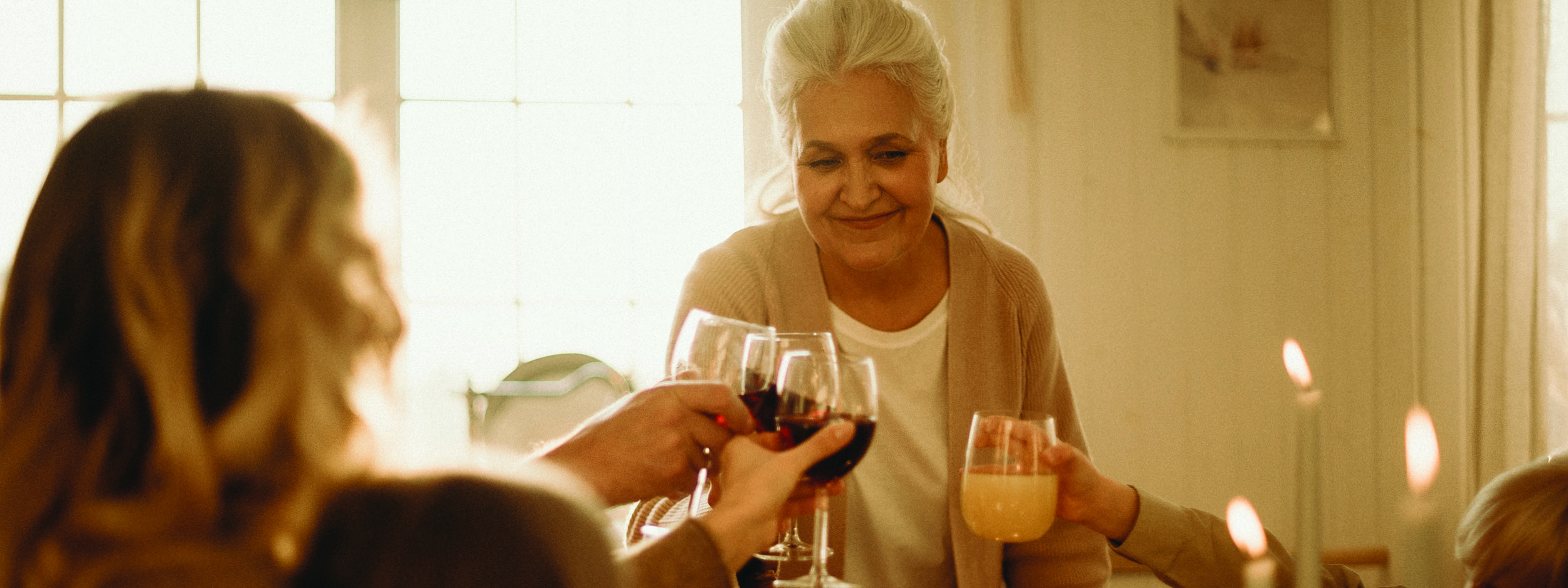 grandmother eating dinner with her family