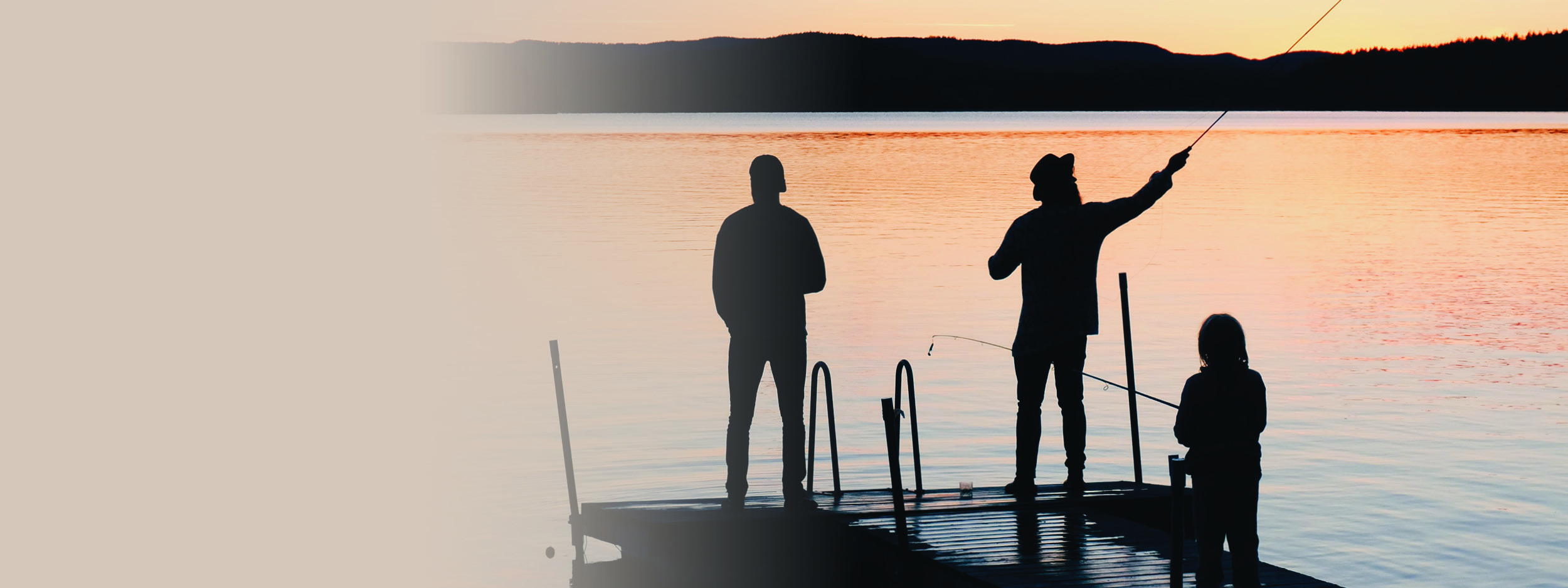 three generations fishing on a dock together