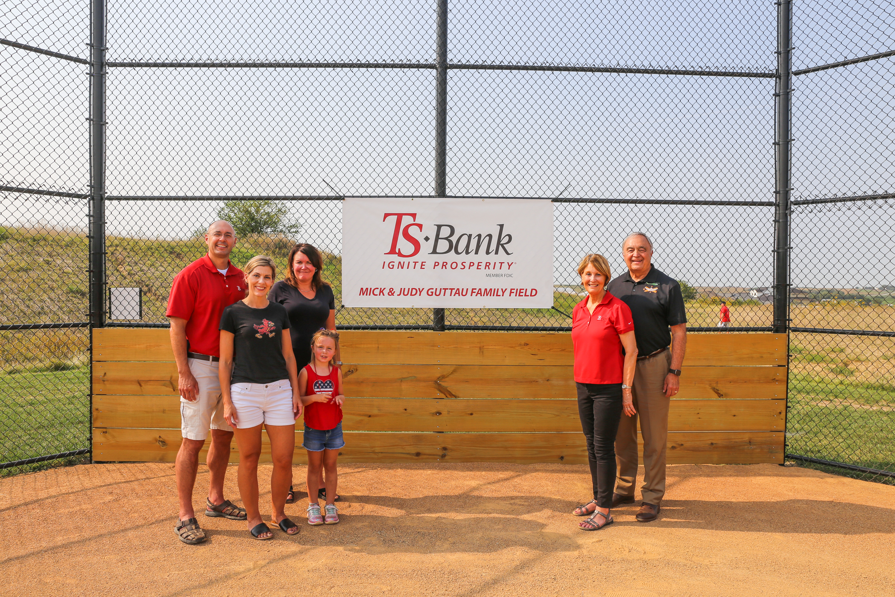 guttau family at ribbon cutting at treynor little league field