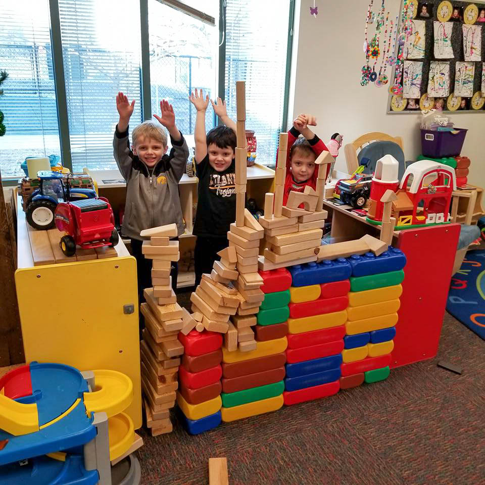 children playing toys at ann wickman center